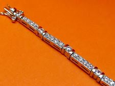Picture of “Channels of Zirconia” tennis bracelet in sterling silver with bezel set cubic zirconia and channels