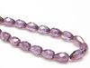 Picture of 10x7 mm, Czech faceted tear-shaped beads, transparent, alexandrite purple luster