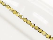 Picture of 4x4 mm, Czech faceted round beads, amber yellow, transparent, gunmetal luster