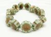 Picture of 14x14 mm, Czech druk beads, Hawaiian flower, celadon green, matte, old gold patina