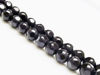 Picture of 8x8 mm, round, gemstone beads, onyx, black, large shiny facets on a frosted round background