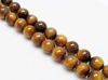 Picture of 10x10 mm, round, gemstone beads, tiger eye, golden-brown, natural, A-grade