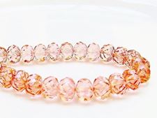 Picture of 7x10 mm, carved cruller beads, Czech, transparent, light topaz pink luster