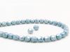 Picture of 4x4 mm, Czech faceted round beads, chalk white, opaque, light Montana blue luster