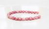 Image de 4x4 mm, perles à facettes tchèques rondes, blanc craie, opaque, lustré rose topaze pâle
