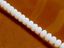 Picture of 3x5 mm, Czech faceted rondelle beads, alabaster white, translucent