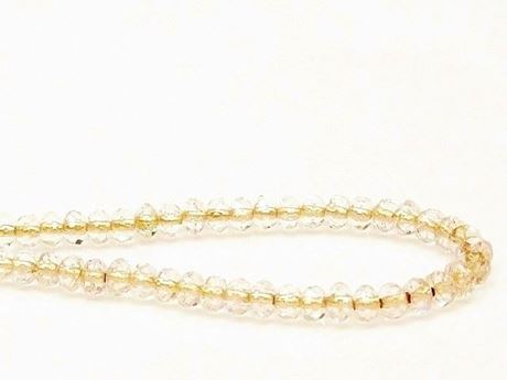 Picture of 3x5 mm, Czech faceted rondelle beads, crystal, transparent, brassy gold-lined