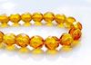 Picture of 8x8 mm, Czech faceted round beads, amber yellow, transparent, pre-strung