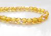 Picture of 4x4 mm, Czech faceted round beads, honey yellow, transparent, AB finishing, pre-strung 