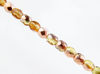 Picture of 3x3 mm, Czech faceted round beads, light topaz yellow, transparent, half tone rose gold mirror