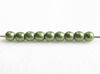 Picture of 3x3 mm, round, Czech druk beads, fern green, opaque, sueded gold