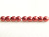Picture of 3x3 mm, round, Czech druk beads, samba red, opaque, sueded gold
