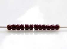 Picture of Japanese seed beads, round, size 11/0, Toho, opaque, oxblood or deep red