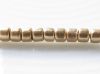 Picture of Czech cylinder seed beads, size 10, metallic, flax or light gold, matte, 5 grams