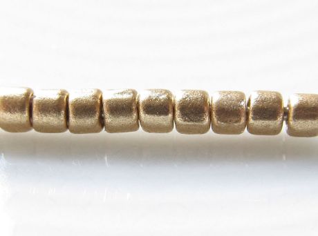 Picture of Czech cylinder seed beads, size 10, metallic, flax or light gold, matte, 5 grams