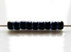 Picture of Czech seed beads, size 8, opaque, jet black, full AB-lined